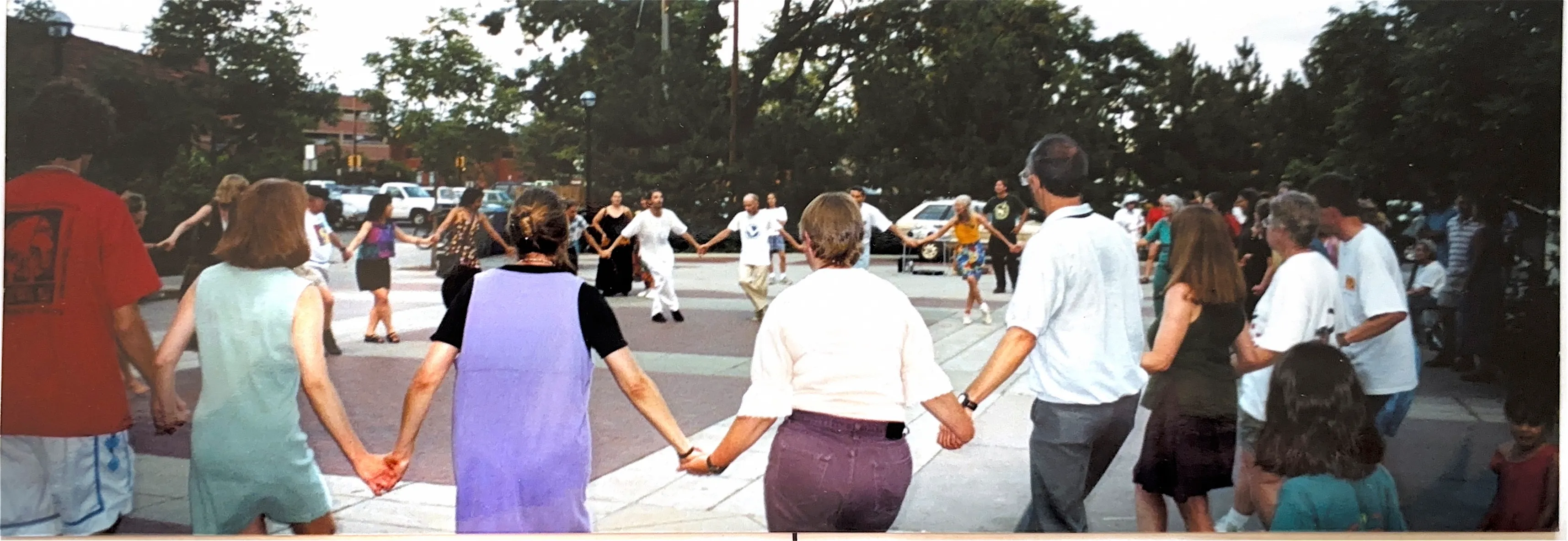 Folk dancers on a plaza.
