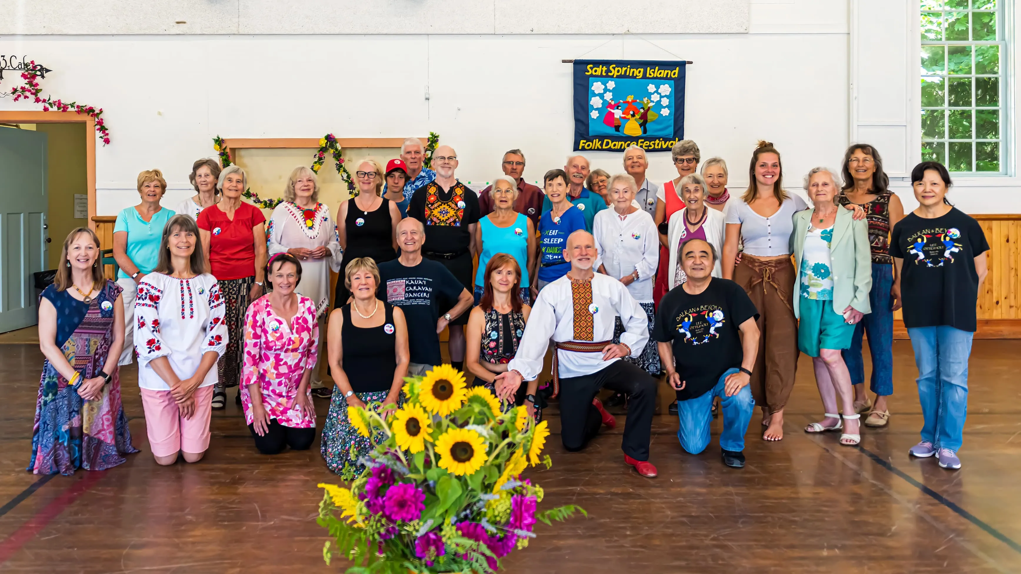 Tom and a class of Postoley folk dancers posing for the camera.