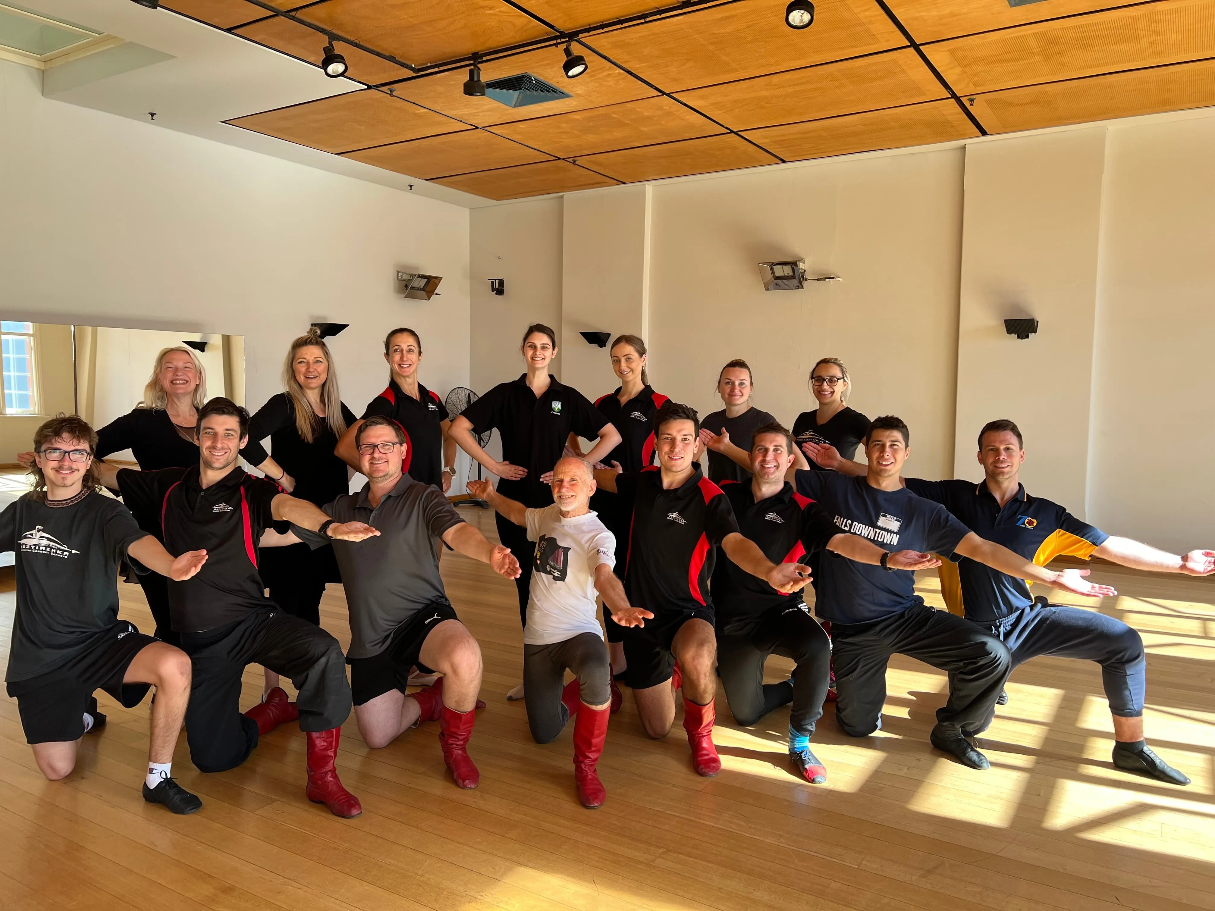 Tom Masterson posing with a group of Folk Dance students.
